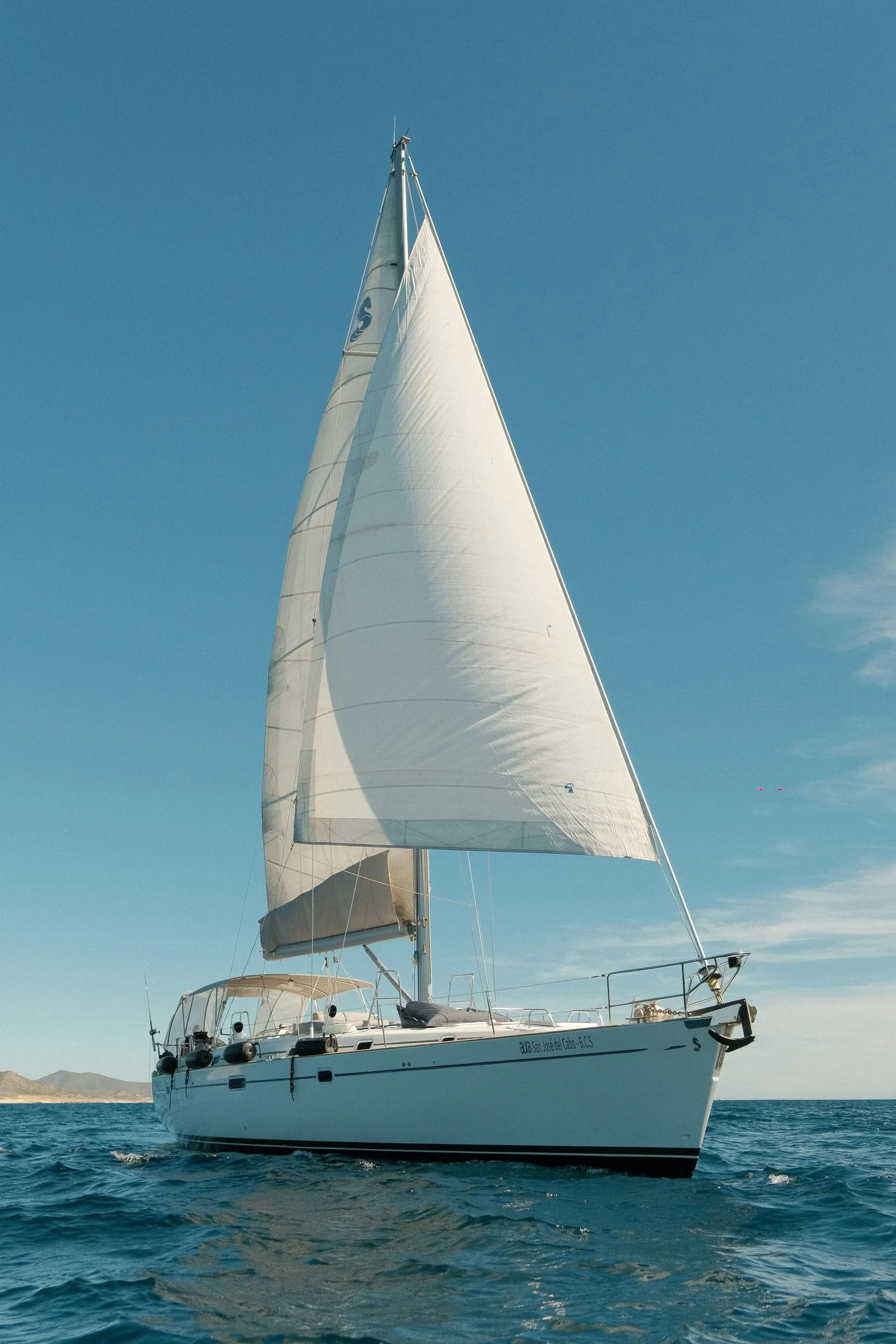 The Aura sailboat under full sail off the coast of San Jose del Cabo