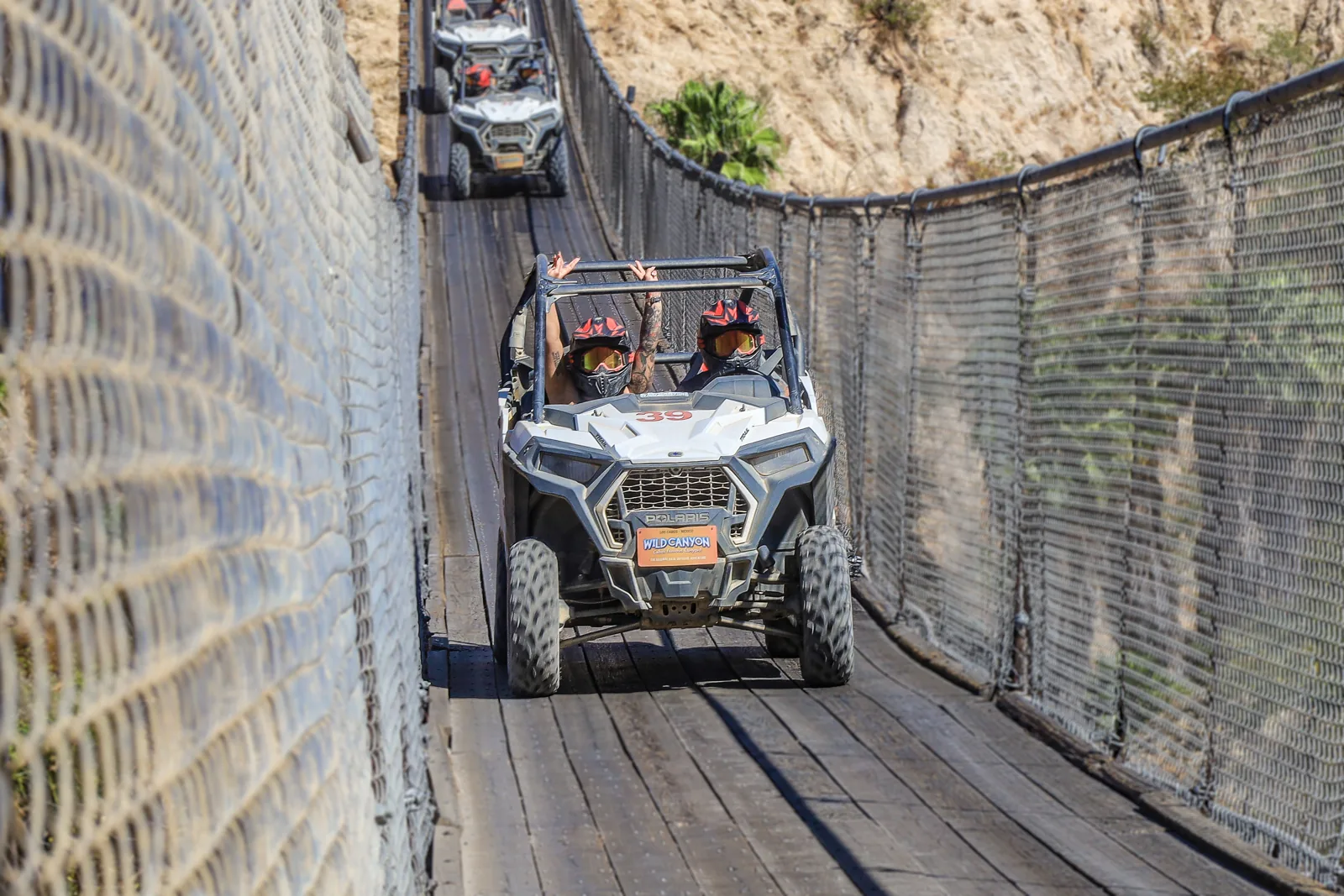 A UTV crossing the Los Cabos canyon hanging bridge