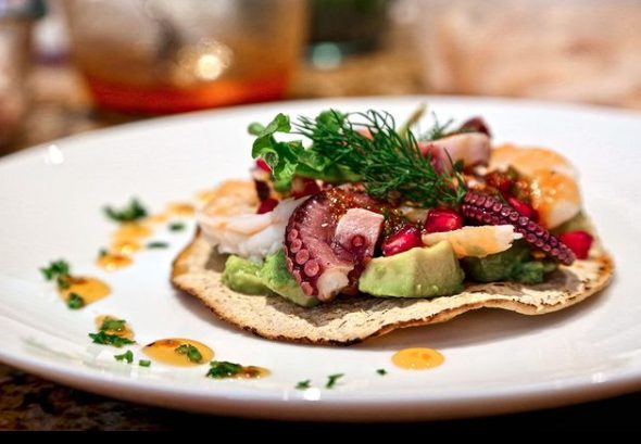 Grilled octopus and shrimp tostada over avocado — Baja Signature