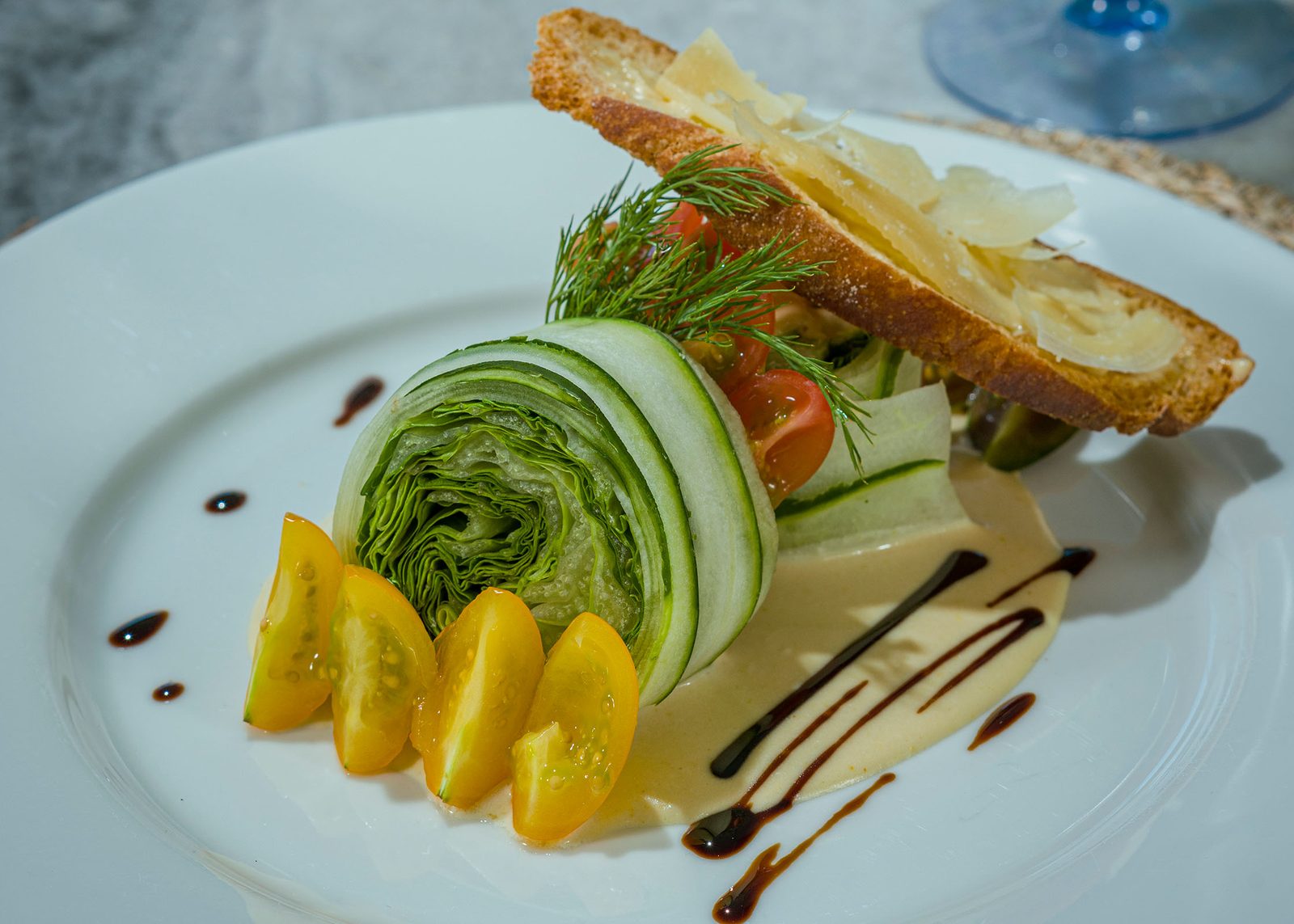 Butter lettuce and cucumber roll salad with parmesan crostini